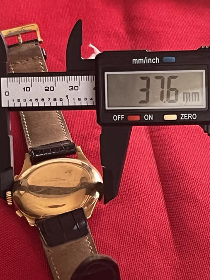 Montre Baume & Mercier chronographe en or 18K